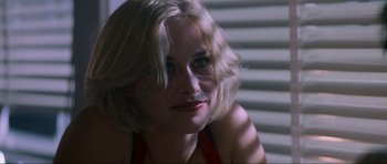 Movie still from “True Romance” (1993), directed by Tony Scott – A person with blond hair; Close Up shot, Over the shoulder angle