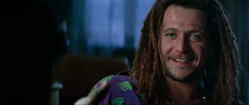 Movie still from “True Romance” (1993), directed by Tony Scott – A person with dreadlocks; Close Up shot, Over the shoulder angle