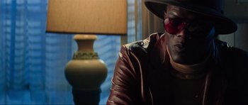 Movie still from “True Romance” (1993), directed by Tony Scott – A man wearing a leather jacket and a mask; Close Up shot, Low angle