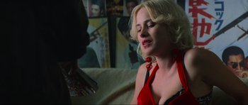 Movie still from “True Romance” (1993), directed by Tony Scott – A woman in a red dress talking to another woman; Close Up shot, Over the shoulder angle