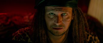 Movie still from “True Romance” (1993), directed by Tony Scott – A person wearing a hat and looking at the camera; Close Up shot, Low angle