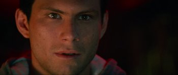 Movie still from “True Romance” (1993), directed by Tony Scott – A man's face in the dark; Close Up shot, Low angle