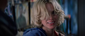 Movie still from “True Romance” (1993), directed by Tony Scott – A person with blonde hair; Close Up shot, Over the shoulder angle