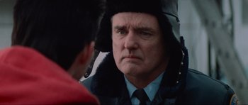 Movie still from “True Romance” (1993), directed by Tony Scott – A man wearing a fur coat looking at himself in the mirror; Close Up shot, Over the shoulder angle