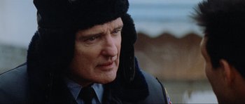 Movie still from “True Romance” (1993), directed by Tony Scott – A person wearing a hat; Close Up shot, Over the shoulder angle