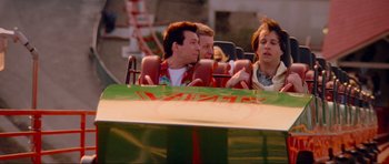 Movie still from “True Romance” (1993), directed by Tony Scott – A group of people riding a roller coaster; Medium shot, High angle