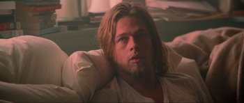 Movie still from “True Romance” (1993), directed by Tony Scott – A person laying on a couch; Close Up shot, Low angle