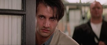 Movie still from “True Romance” (1993), directed by Tony Scott – A person wearing a jacket; Close Up shot, Low angle