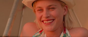 Movie still from “True Romance” (1993), directed by Tony Scott – A person wearing a hat; Close Up shot, Over the shoulder angle