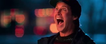 A person wearing a hat with lights in the background