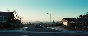 Movie still from “Twilight” (2008), directed by Catherine Hardwicke – A car is parked in the middle of a parking lot; Extreme Wide shot, High angle