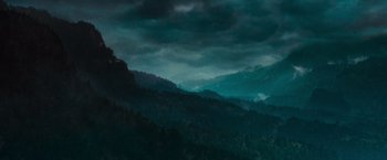 Movie still from “Twilight” (2008), directed by Catherine Hardwicke – A view of a dark sky over a mountain range; Extreme Wide shot, High angle