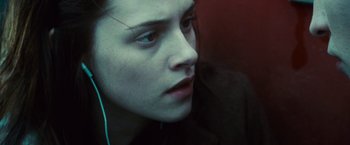 Movie still from “Twilight” (2008), directed by Catherine Hardwicke – A person wearing headphones; Close Up shot, High angle