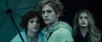 Movie still from “Twilight” (2008), directed by Catherine Hardwicke – A man and a woman standing next to each other in a car; Close Up shot, High angle