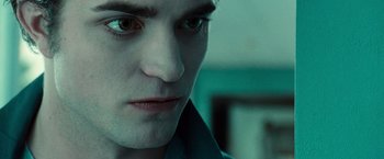 Movie still from “Twilight” (2008), directed by Catherine Hardwicke – A man's face in a green room; Close Up shot, High angle
