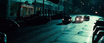 Movie still from “Twilight” (2008), directed by Catherine Hardwicke – A car driving down a street at night; Extreme Wide shot, High angle