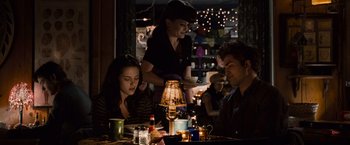 Movie still from “Twilight” (2008), directed by Catherine Hardwicke – A group of people sitting at a table with food; Medium shot, Over the shoulder angle