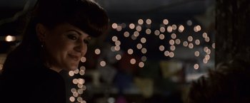 Movie still from “Twilight” (2008), directed by Catherine Hardwicke – A person with lights in the background; Close Up shot, Over the shoulder angle