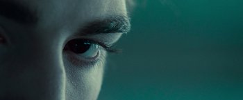 Movie still from “Twilight” (2008), directed by Catherine Hardwicke – A person's eye with a green background; Extreme Close Up shot, High angle
