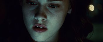 Movie still from “Twilight” (2008), directed by Catherine Hardwicke – A woman's face with green lighting; Extreme Close Up shot, Overhead angle