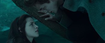 Movie still from “Twilight” (2008), directed by Catherine Hardwicke – A man and a woman looking at each other in a mirror; Close Up shot, Overhead angle