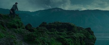 Movie still from “Twilight” (2008), directed by Catherine Hardwicke – A mountain range with a dark cloudy sky above it; Extreme Wide shot, Low angle