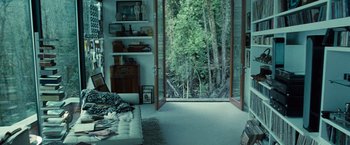 Movie still from “Twilight” (2008), directed by Catherine Hardwicke – A living room with a couch and a large open window; Wide shot, High angle
