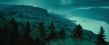 Movie still from “Twilight” (2008), directed by Catherine Hardwicke – A view of a mountain range with trees in the foreground; Extreme Wide shot, High angle
