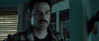 Movie still from “Twilight” (2008), directed by Catherine Hardwicke – A person with a beard and mustache; Close Up shot, Over the shoulder angle