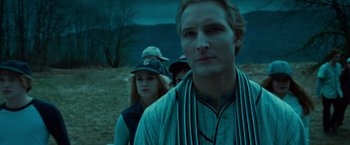 Movie still from “Twilight” (2008), directed by Catherine Hardwicke – A man standing next to two other people in a field at night; Close Up shot, Over the shoulder angle