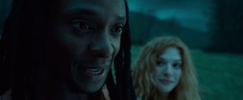 Movie still from “Twilight” (2008), directed by Catherine Hardwicke – A man and a woman are smiling for the camera; Close Up shot, Over the shoulder angle