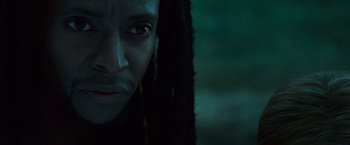 Movie still from “Twilight” (2008), directed by Catherine Hardwicke – A person with dreads looking at the camera; Close Up shot, Over the shoulder angle