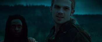 Movie still from “Twilight” (2008), directed by Catherine Hardwicke – A young man is smiling for the camera; Close Up shot, Over the shoulder angle