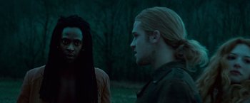 Movie still from “Twilight” (2008), directed by Catherine Hardwicke – Two people standing next to each other on a field; Close Up shot, Over the shoulder angle