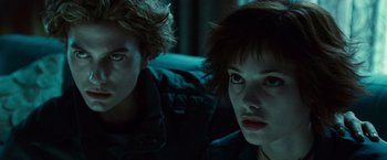 Movie still from “Twilight” (2008), directed by Catherine Hardwicke – A couple of people sitting next to each other in a room; Close Up shot, Low angle