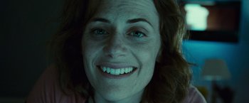 Movie still from “Twilight” (2008), directed by Catherine Hardwicke – A woman's face with green eyes; Close Up shot, Overhead angle