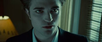Movie still from “Twilight” (2008), directed by Catherine Hardwicke – A person wearing a suit and tie; Close Up shot, Over the shoulder angle