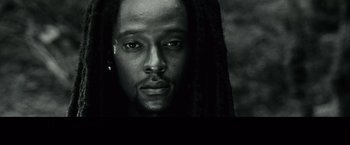 Movie still from “Twilight” (2008), directed by Catherine Hardwicke – A black and white photo of a man with long dreadlocks; Close Up shot, Low angle