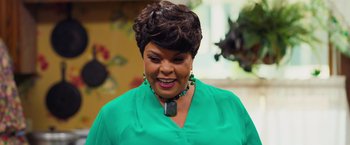 Movie still from “Tyler Perry's A Madea Homecoming” (2022), directed by Tyler Perry – A person wearing a green shirt; Close Up shot, Over the shoulder angle