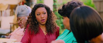 Movie still from “Tyler Perry's A Madea Homecoming” (2022), directed by Tyler Perry – Two women talking to each other outside in a park; Close Up shot, Over the shoulder angle