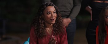 Movie still from “Tyler Perry's A Madea Homecoming” (2022), directed by Tyler Perry – A person clapping her hands; Close Up shot, Over the shoulder angle