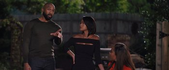 Movie still from “Tyler Perry's A Madea Homecoming” (2022), directed by Tyler Perry – A group of people that are standing up talking to each other; Medium shot, Over the shoulder angle