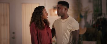 Movie still from “Tyler Perry's A Madea Homecoming” (2022), directed by Tyler Perry – A man and a woman standing next to each other; Medium shot, Over the shoulder angle