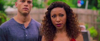 Movie still from “Tyler Perry's A Madea Homecoming” (2022), directed by Tyler Perry – A person with curly brown hair; Close Up shot, Over the shoulder angle