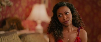 Movie still from “Tyler Perry's A Madea Homecoming” (2022), directed by Tyler Perry – A person with curly black hair; Close Up shot, Over the shoulder angle