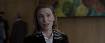 Movie still from “Tár” (2022), directed by Todd Field – A person wearing a jacket; Close Up shot, Over the shoulder angle