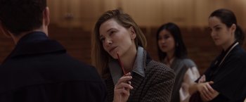 Movie still from “Tár” (2022), directed by Todd Field – A woman holding a red pencil in her hand; Close Up shot, Over the shoulder angle