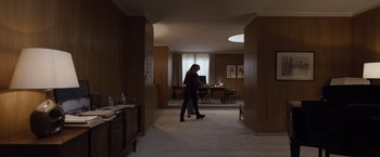 Movie still from “Tár” (2022), directed by Todd Field – A woman standing in the middle of a room; Wide shot, High angle