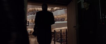 Movie still from “Tár” (2022), directed by Todd Field – A man standing in front of an audience in an auditorium; Extreme Wide shot, Low angle