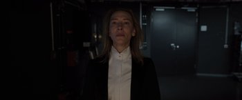 Movie still from “Tár” (2022), directed by Todd Field – A woman wearing a white shirt and a black jacket; Close Up shot, Low angle